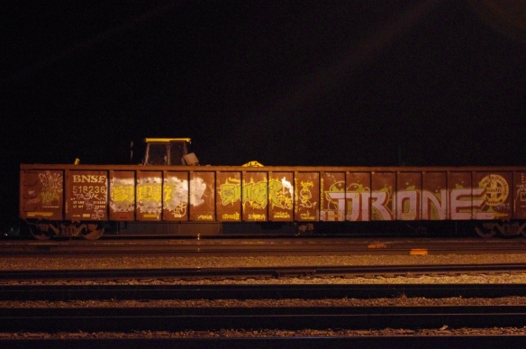 Graffiti-covered gondola railroad car